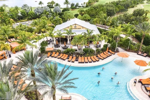 an aerial view of a house with swimming pool garden and patio