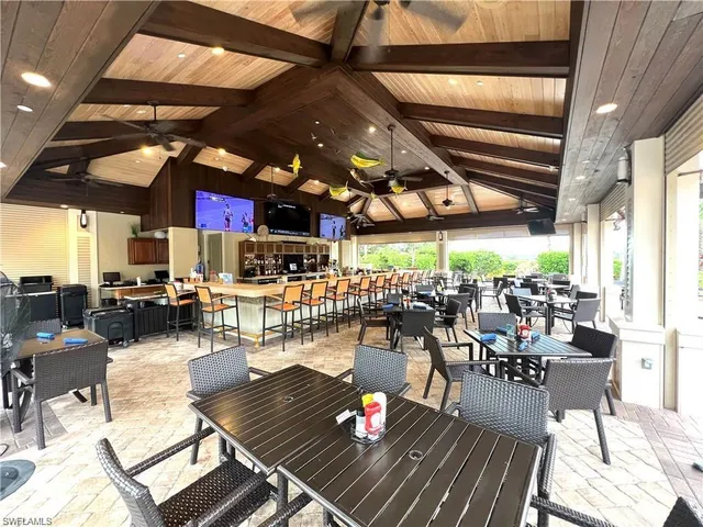 a view of a chairs and tables in a patio