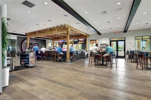 a view of a big room with lots of furniture and lots of furniture