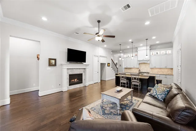 a living room with fireplace furniture and a flat screen tv