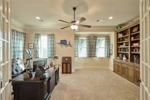 a living room with furniture fireplace and a large window
