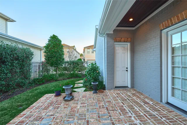 a view of a backyard with sitting area