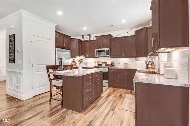 a kitchen with a sink a counter top space and appliances