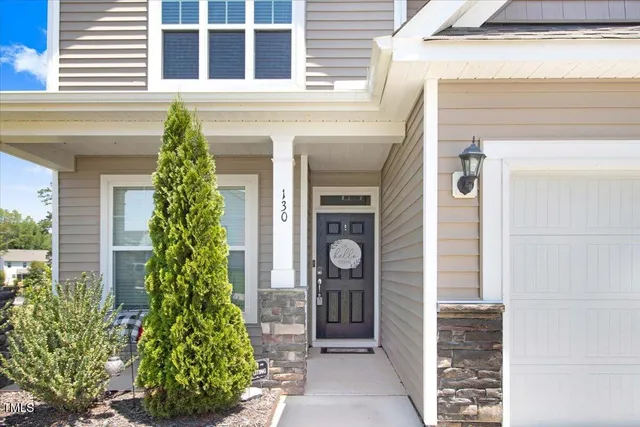 a front view of a house with a porch