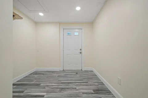 a kitchen with kitchen island a counter top space a sink stainless steel appliances and cabinets