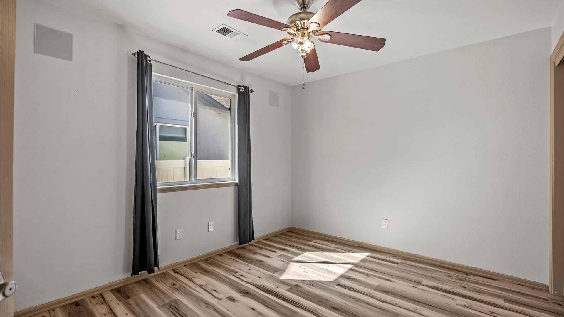 596 Sinatra Way Grand Junction, CO 81501 - Photo 11 of 20 a view of empty room with wooden floor