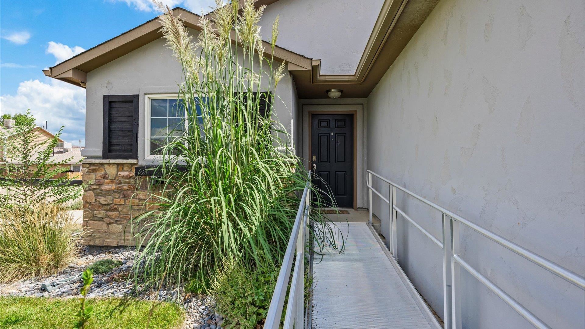 596 Sinatra Way Grand Junction, CO 81501 - Photo 17 of 20 a view of a pathway along with potted plants