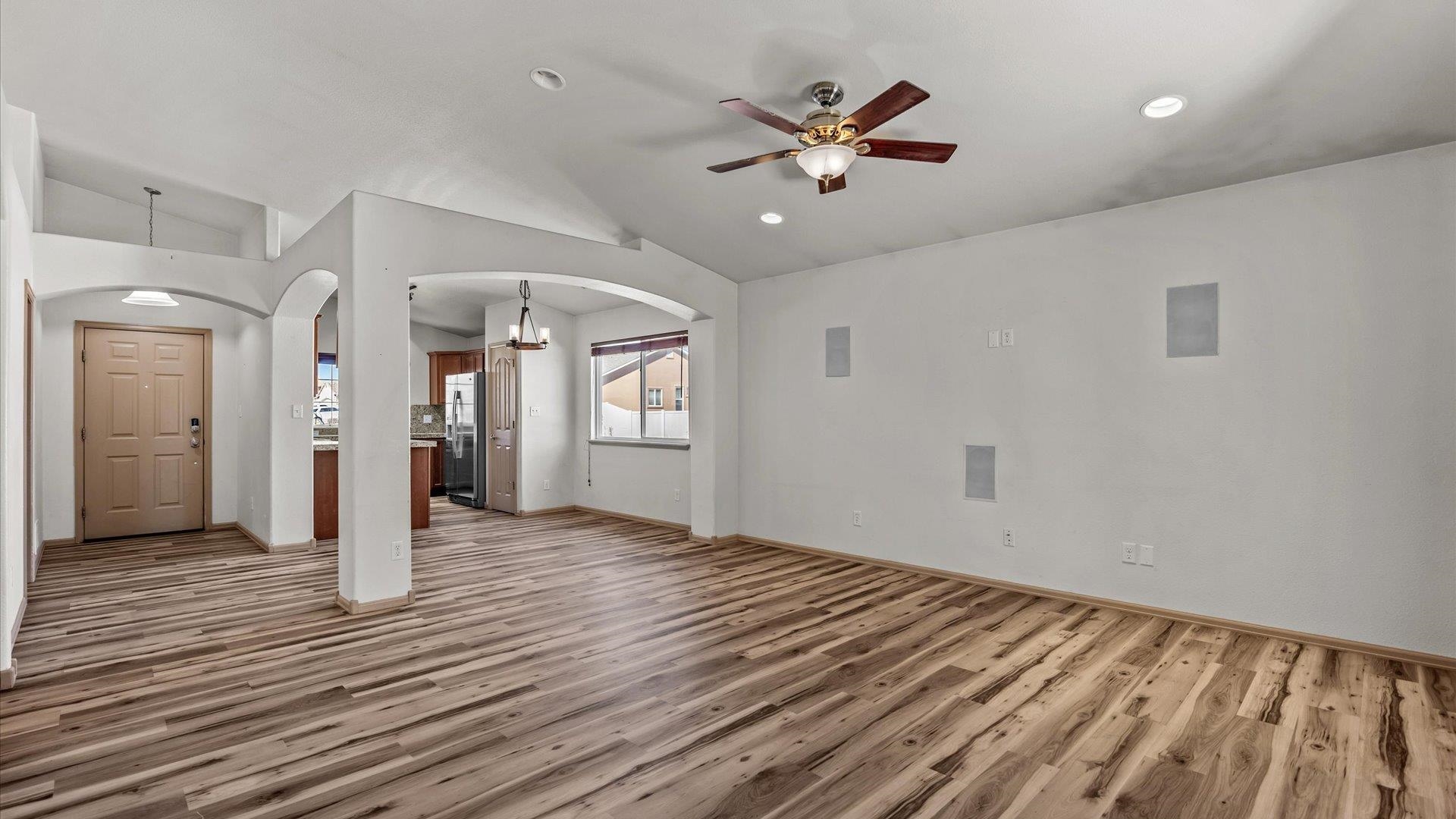 596 Sinatra Way Grand Junction, CO 81501 - Photo 2 of 20 wooden floor in an empty room with a window