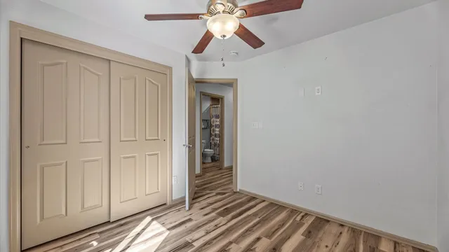 a view of room with chandelier fan