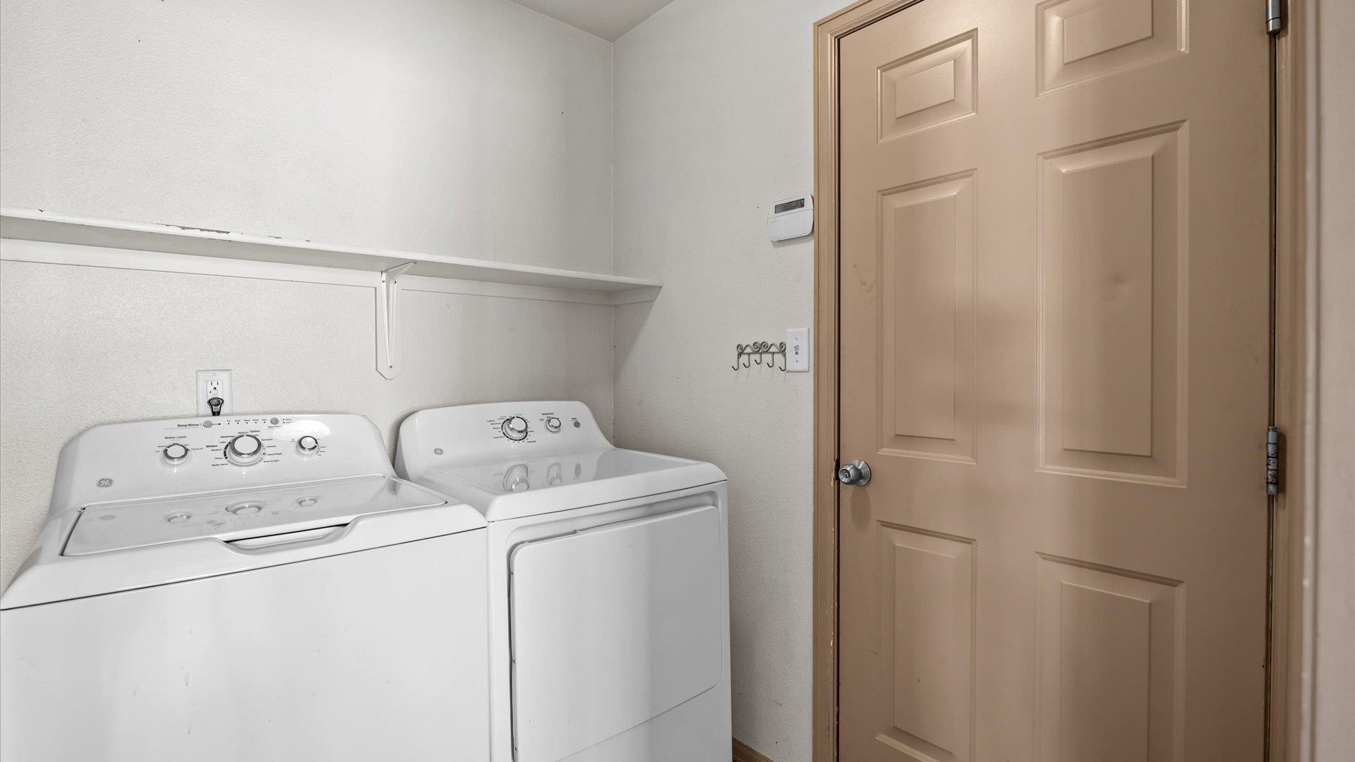 596 Sinatra Way Grand Junction, CO 81501 - Photo 8 of 20 a utility room with dryer and washer