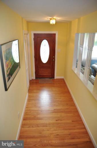 5229 Inverchapel Road Springfield, VA 22151 - Photo 2 of 27 a view of a hallway with wooden floor