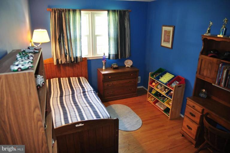 5229 Inverchapel Road Springfield, VA 22151 - Photo 11 of 27 a bedroom with furniture and a window