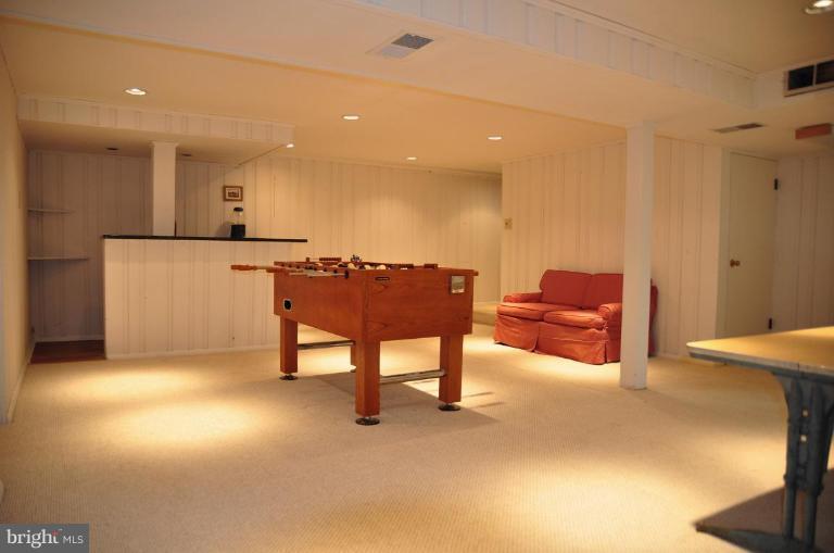 5229 Inverchapel Road Springfield, VA 22151 - Photo 13 of 27 a living room with furniture and a refrigerator