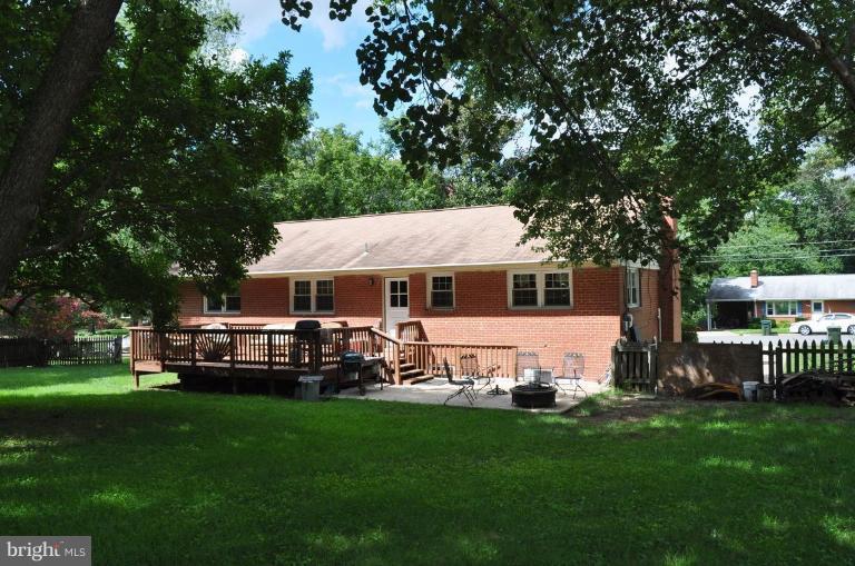 5229 Inverchapel Road Springfield, VA 22151 - Photo 15 of 27 a view of a house with a yard porch and sitting area
