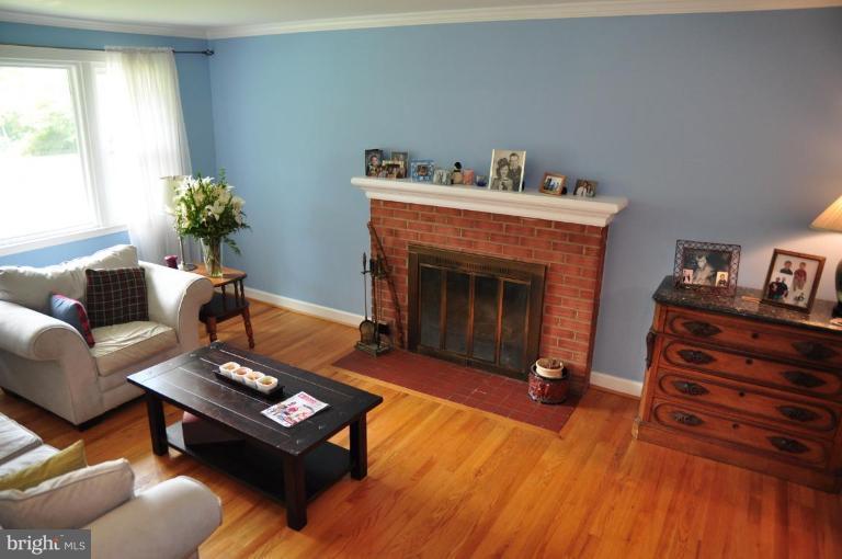 5229 Inverchapel Road Springfield, VA 22151 - Photo 16 of 27 a living room with furniture and a fireplace