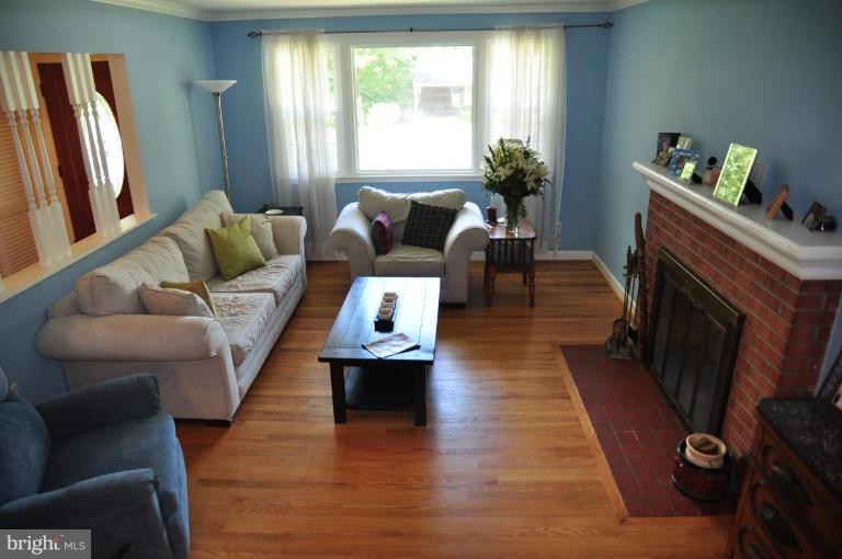 5229 Inverchapel Road Springfield, VA 22151 - Photo 17 of 27 a living room with furniture and a fireplace