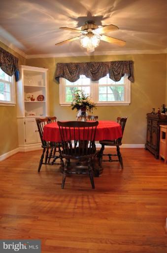 5229 Inverchapel Road Springfield, VA 22151 - Photo 18 of 27 a view of a dining room with furniture window and wooden floor