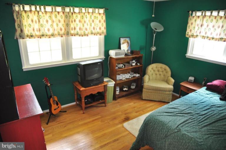 5229 Inverchapel Road Springfield, VA 22151 - Photo 21 of 27 a bedroom with furniture and a window
