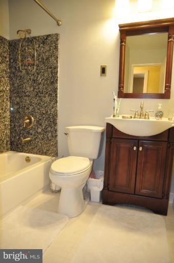 5229 Inverchapel Road Springfield, VA 22151 - Photo 22 of 27 a bathroom with a sink a toilet and shower
