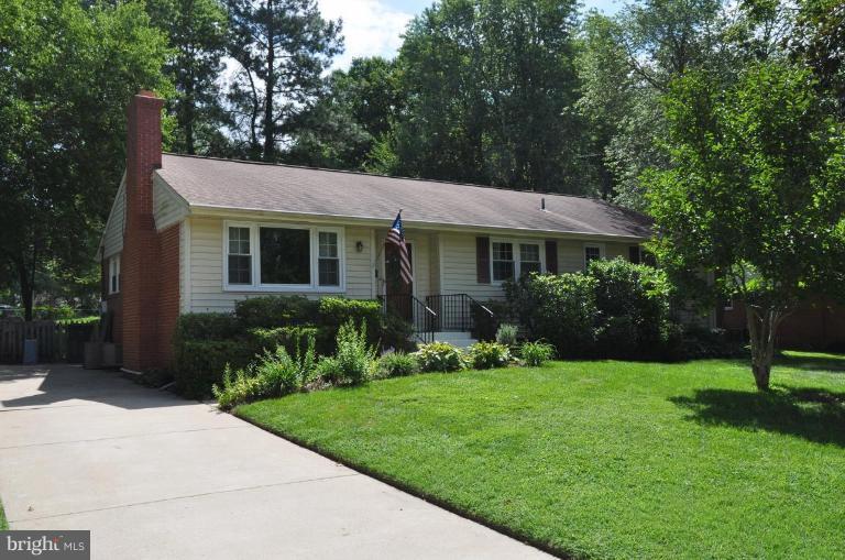 5229 Inverchapel Road Springfield, VA 22151 - Photo 25 of 27 a front view of a house with a yard and garage