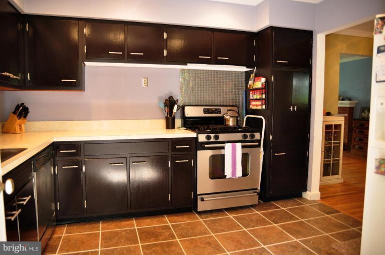 5229 Inverchapel Road Springfield, VA 22151 - Photo 8 of 27 a kitchen with stainless steel appliances granite countertop a refrigerator and a stove