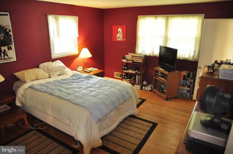 5229 Inverchapel Road Springfield, VA 22151 - Photo 9 of 27 a bedroom with bed tv and window
