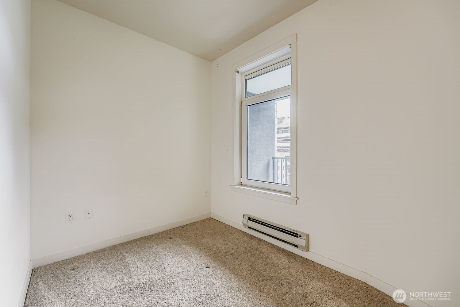 2607 Western Avenue, Unit 612 Seattle, WA 98121 - Photo 16 of 29 an empty room with windows