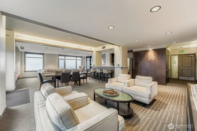 a living room with fireplace furniture and a wooden floor
