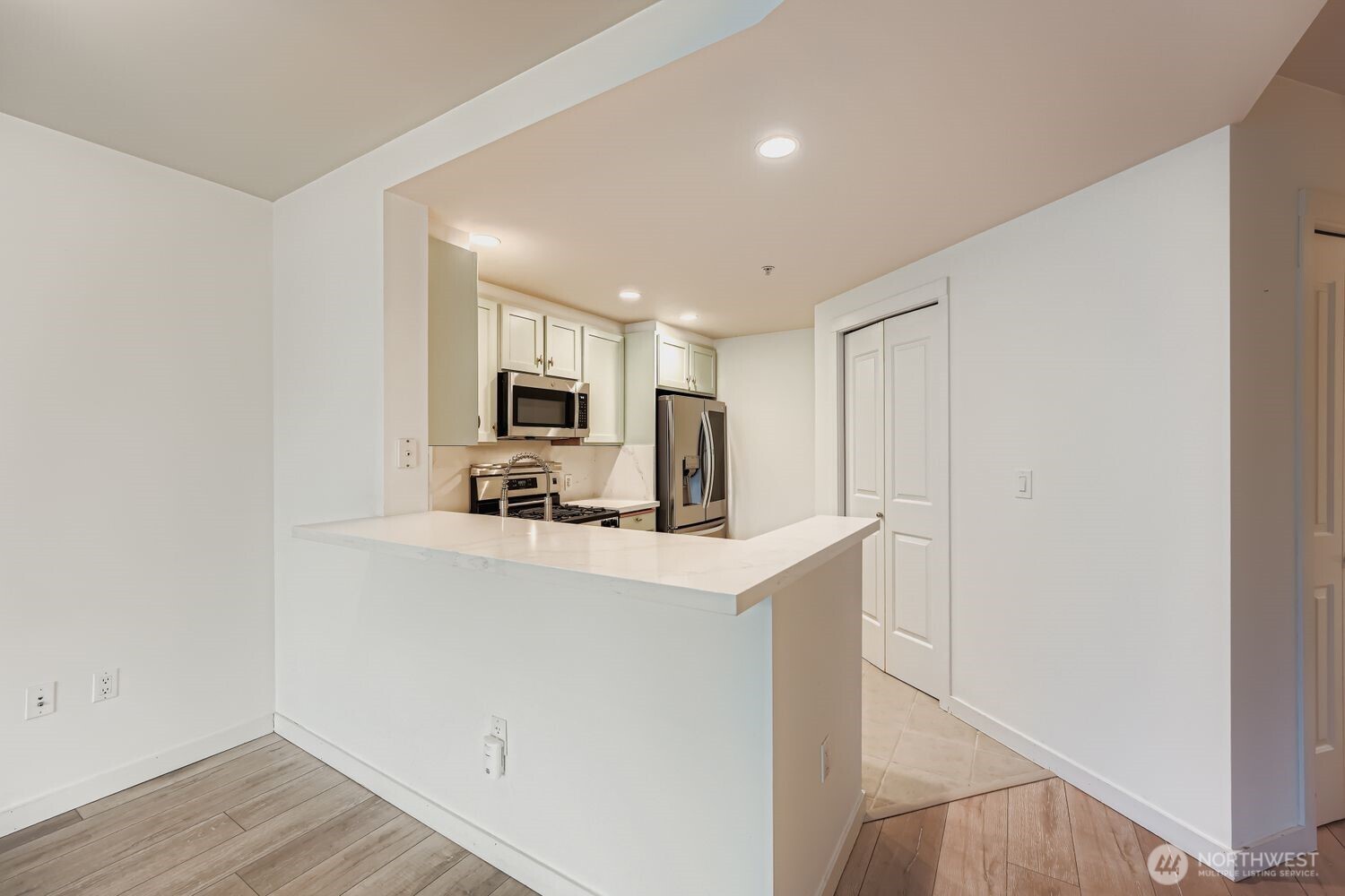 2607 Western Avenue, Unit 612 Seattle, WA 98121 - Photo 8 of 29 a view of kitchen with stainless steel appliances granite countertop refrigerator sink and stove