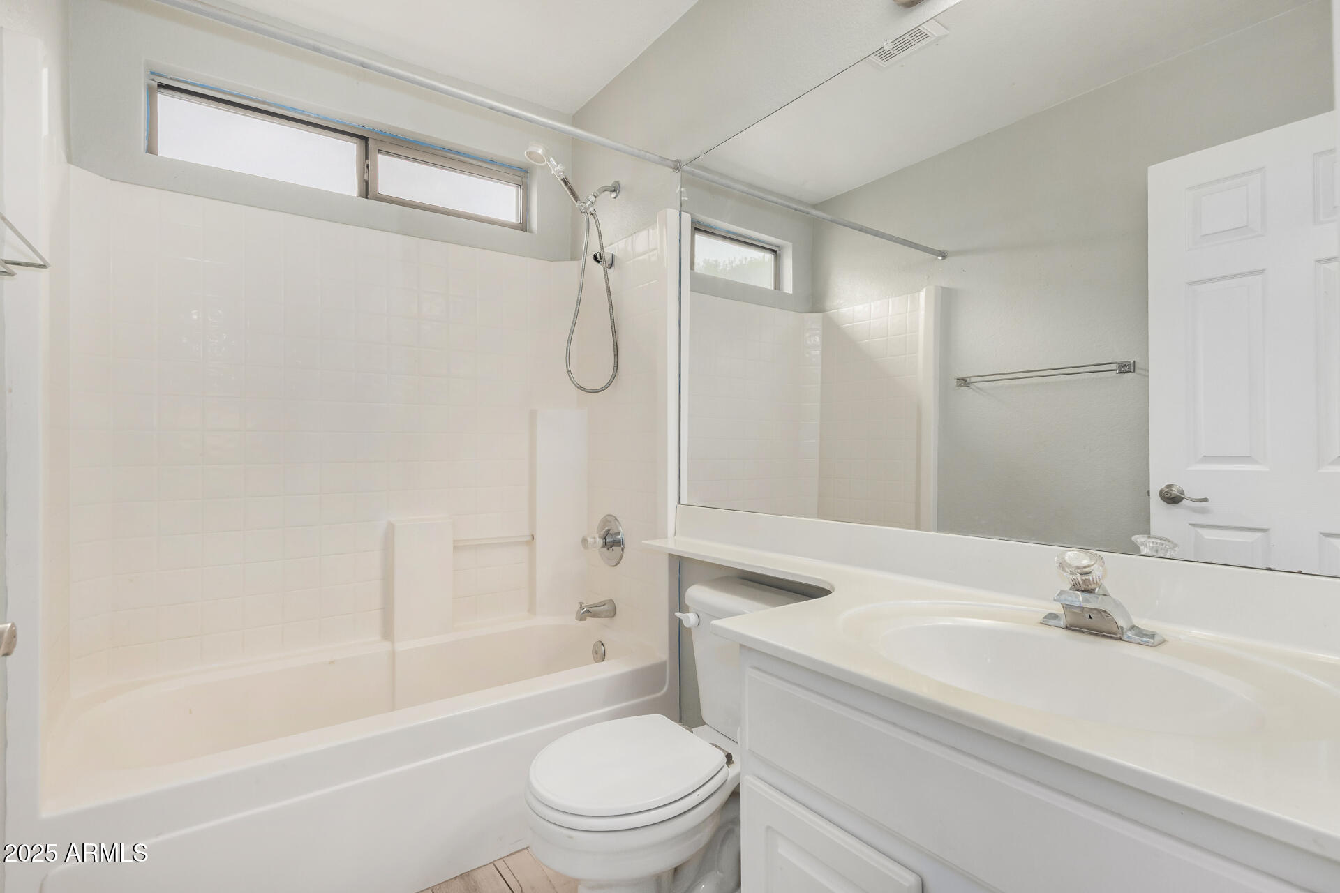 3942 East Agave Road Phoenix, AZ 85044 - Photo 24 of 30 a bathroom with a sink a toilet and a bathtub
