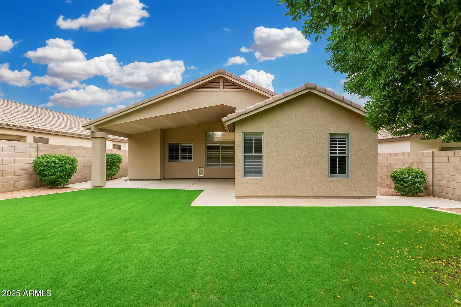 3942 East Agave Road Phoenix, AZ 85044 - Photo 29 of 30 a front view of a house with a yard