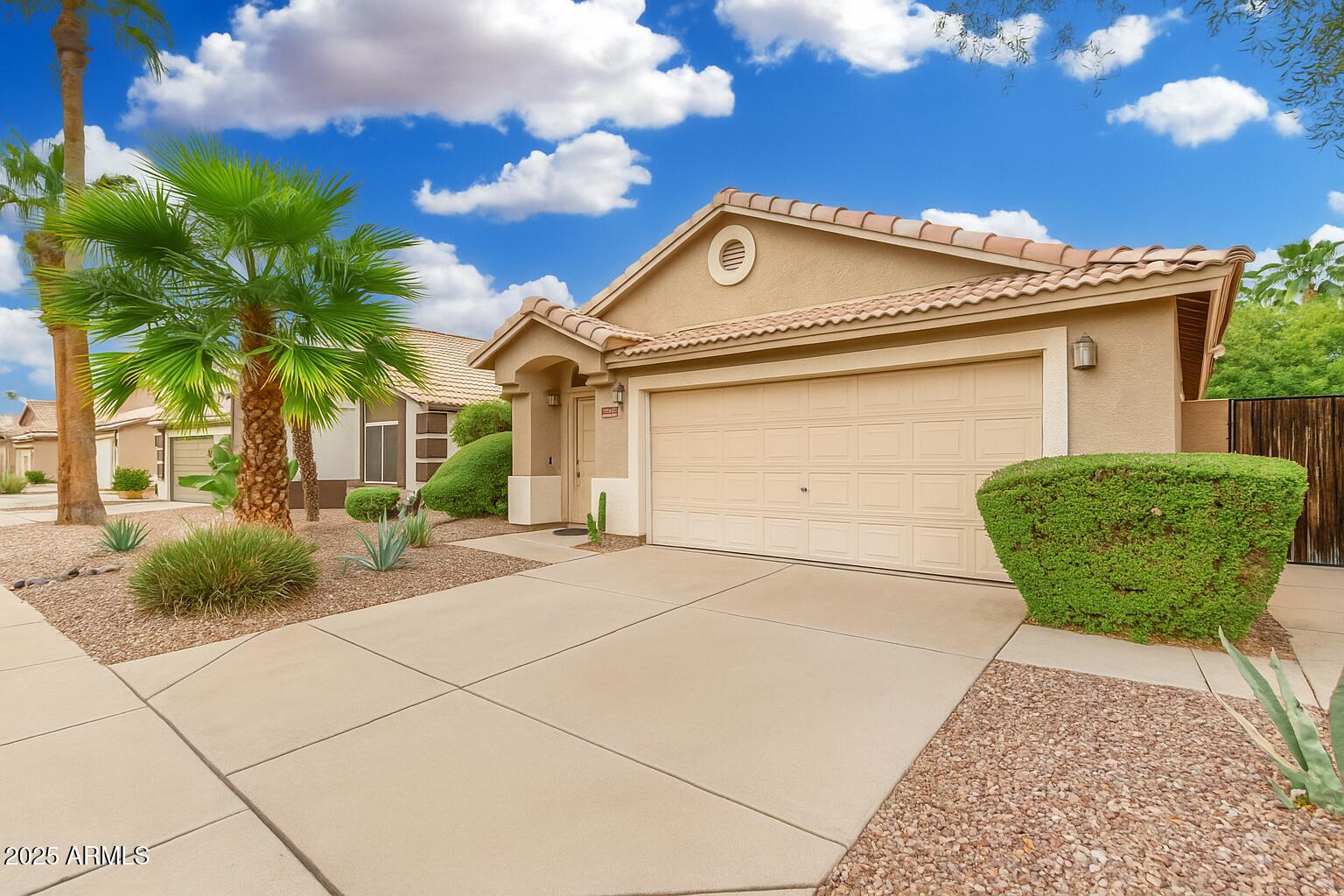 3942 East Agave Road Phoenix, AZ 85044 - Photo 4 of 30 a view of a house with a patio