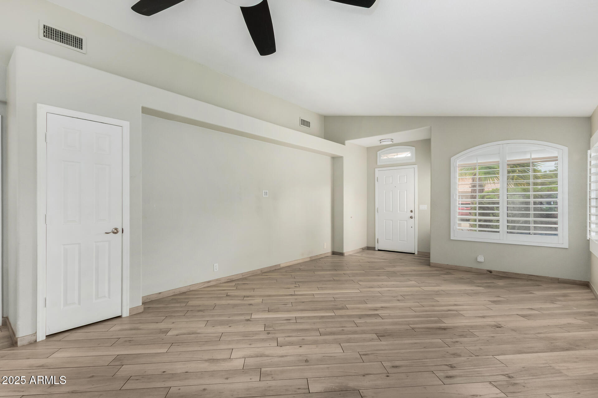 3942 East Agave Road Phoenix, AZ 85044 - Photo 7 of 30 a view of an empty room with a window