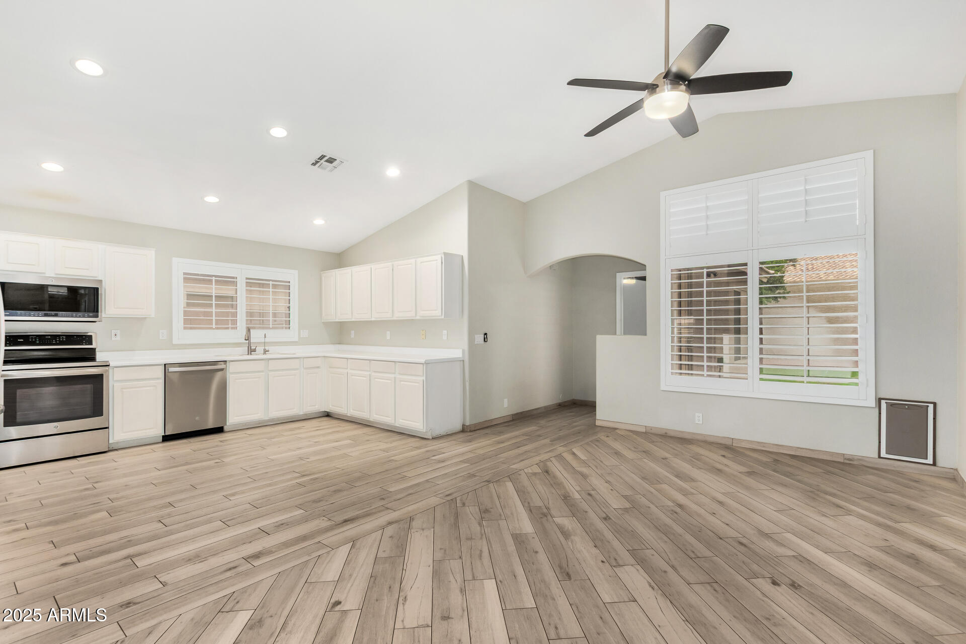 3942 East Agave Road Phoenix, AZ 85044 - Photo 10 of 30 a view of a kitchen with microwave and stove