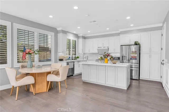 a living room with kitchen island furniture and a large window