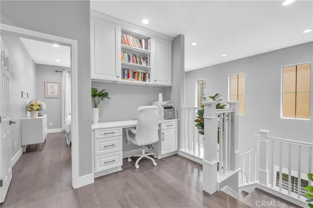 a view of a workspace with furniture and toys