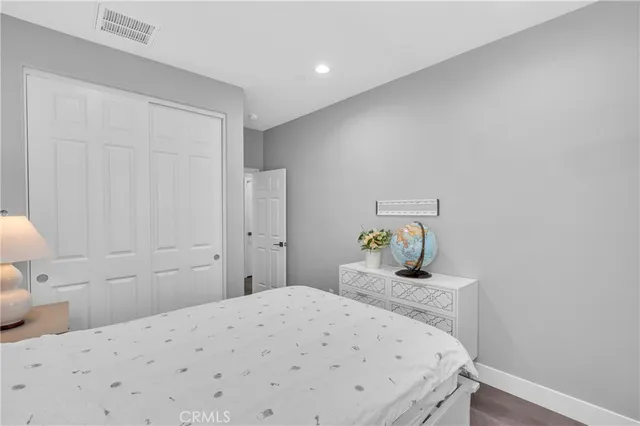 a bedroom with a bed and hallway