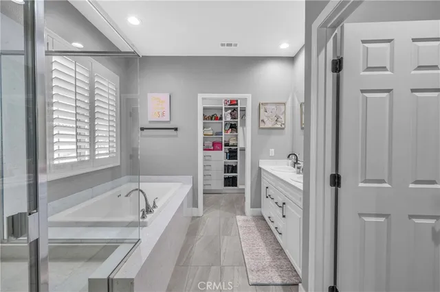 a bathroom with a bathtub and a shower