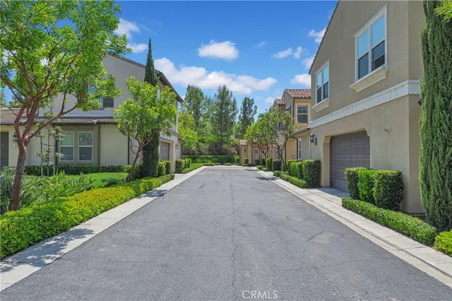 a front view of a house with a yard and a garage