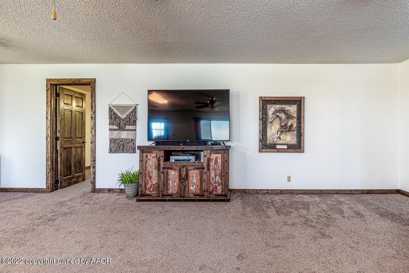 8780 County Line Road Fritch, TX 79036 - Photo 13 of 48 a living room with furniture and a flat screen tv