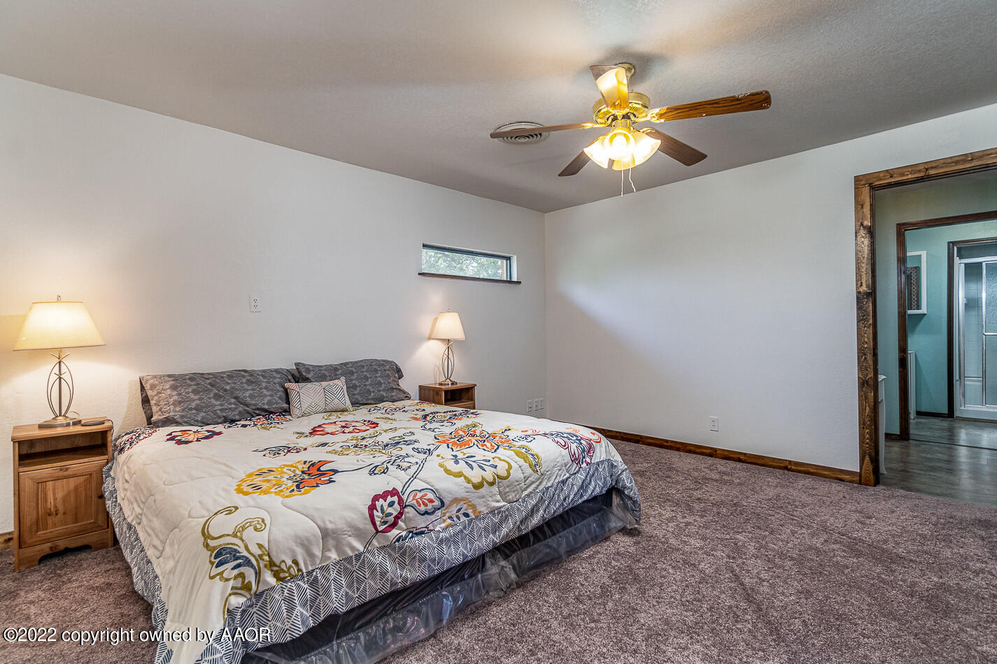 8780 County Line Road Fritch, TX 79036 - Photo 15 of 48 a bedroom with a bed and a chandelier