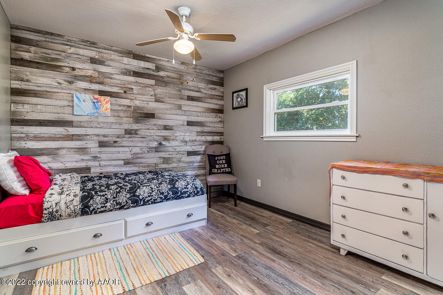 8780 County Line Road Fritch, TX 79036 - Photo 19 of 48 a room with a wooden floor and window