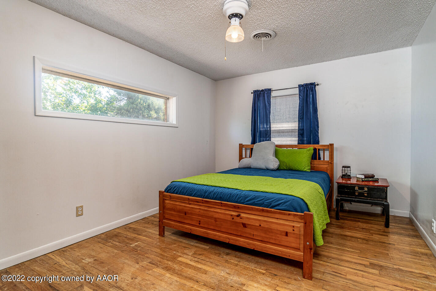 8780 County Line Road Fritch, TX 79036 - Photo 21 of 48 a bedroom with a bed and a chandelier