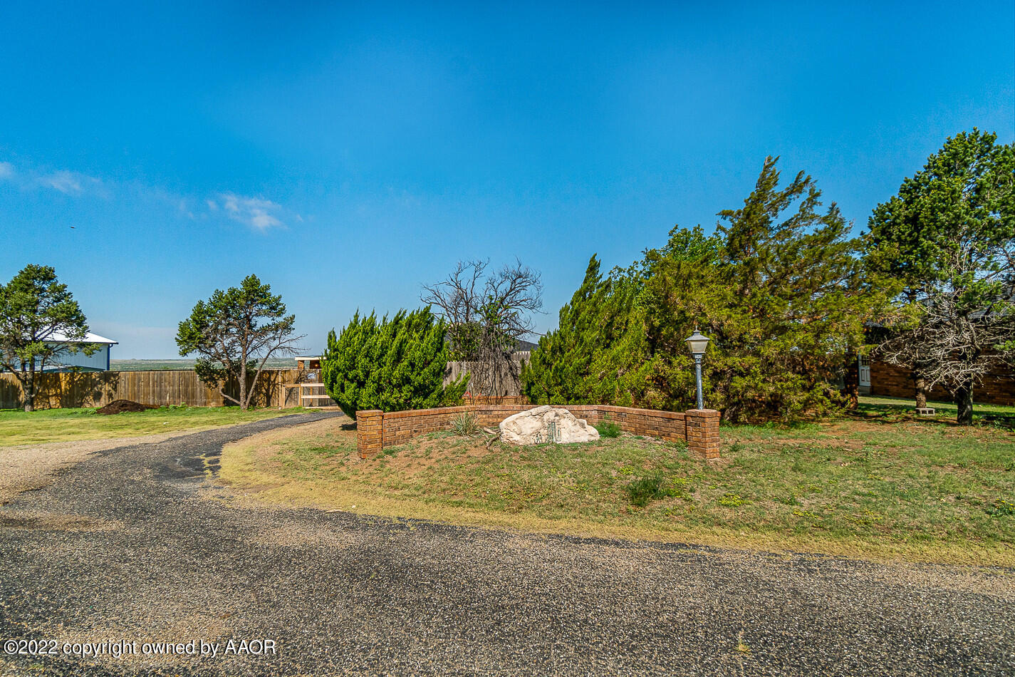 8780 County Line Road Fritch, TX 79036 - Photo 4 of 48 a view of a yard with an trees