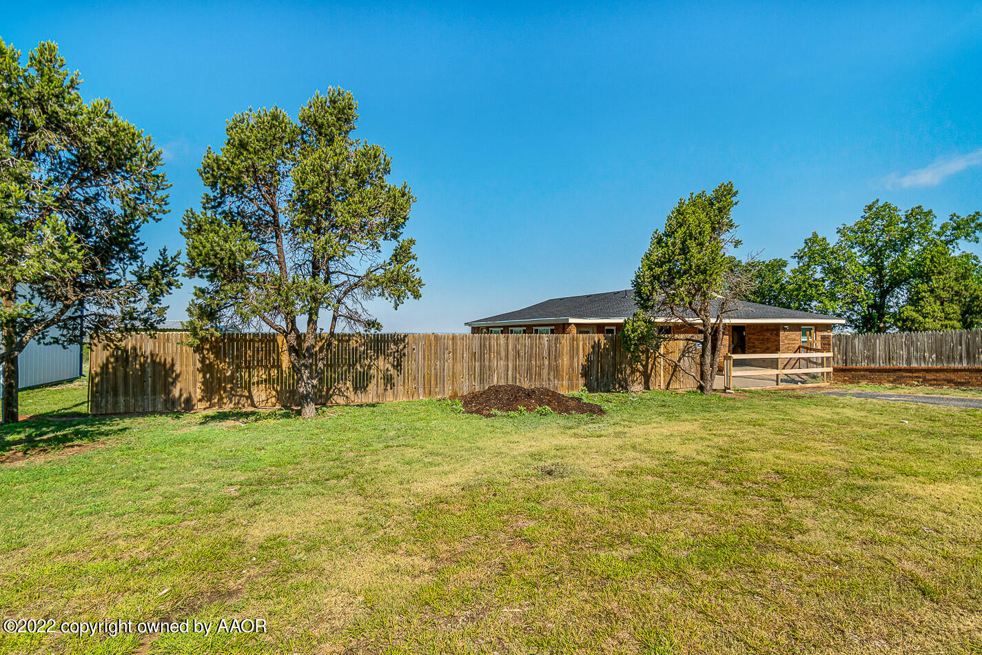8780 County Line Road Fritch, TX 79036 - Photo 5 of 48 a front view of a house with a yard