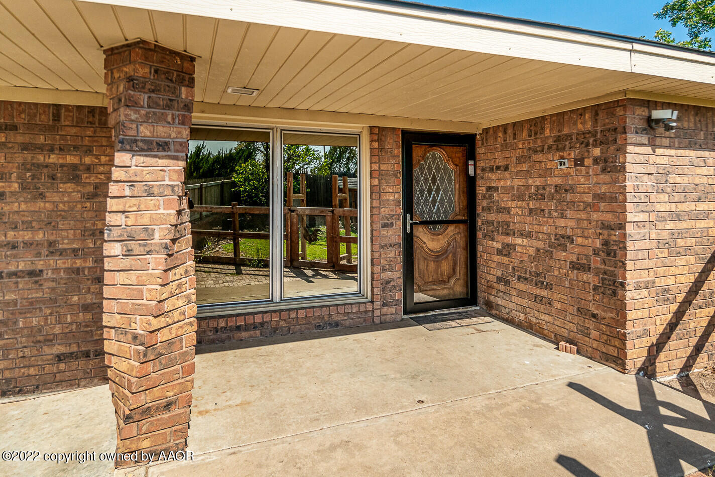 8780 County Line Road Fritch, TX 79036 - Photo 7 of 48 a front view of a house with a garden