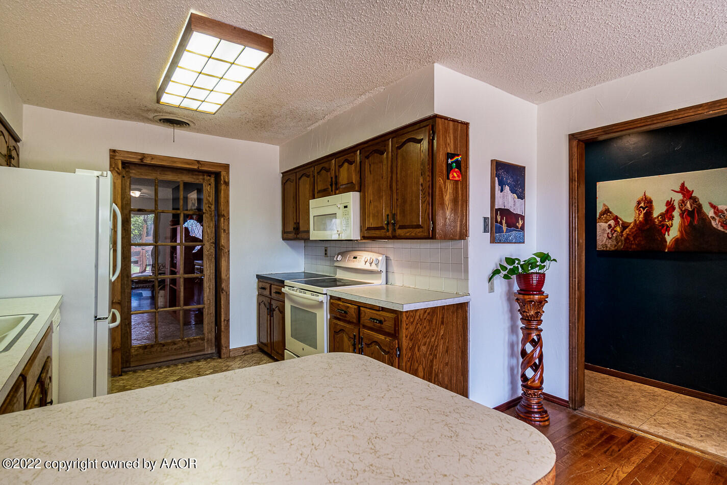 8780 County Line Road Fritch, TX 79036 - Photo 9 of 48 a spacious bedroom with a bed and a flat screen tv