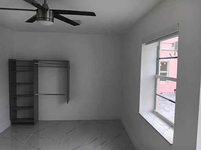 a view of an empty room with a window