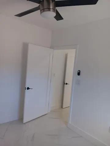 a view of a utility room with closet