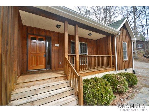 164 Thistle Ridge Clyde, NC 28721 - Photo 2 of 16 a view of a house with a small yard and wooden floor and fence